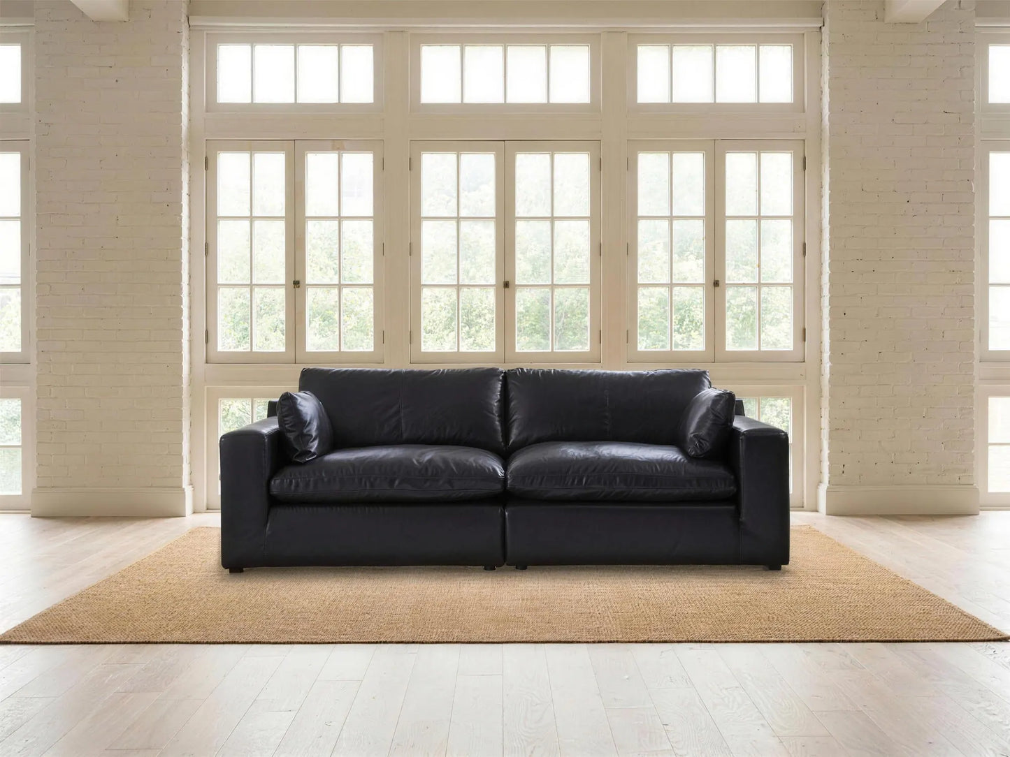 Emilia 2-Piece Loveseat in black top-grain leather, styled in a living room