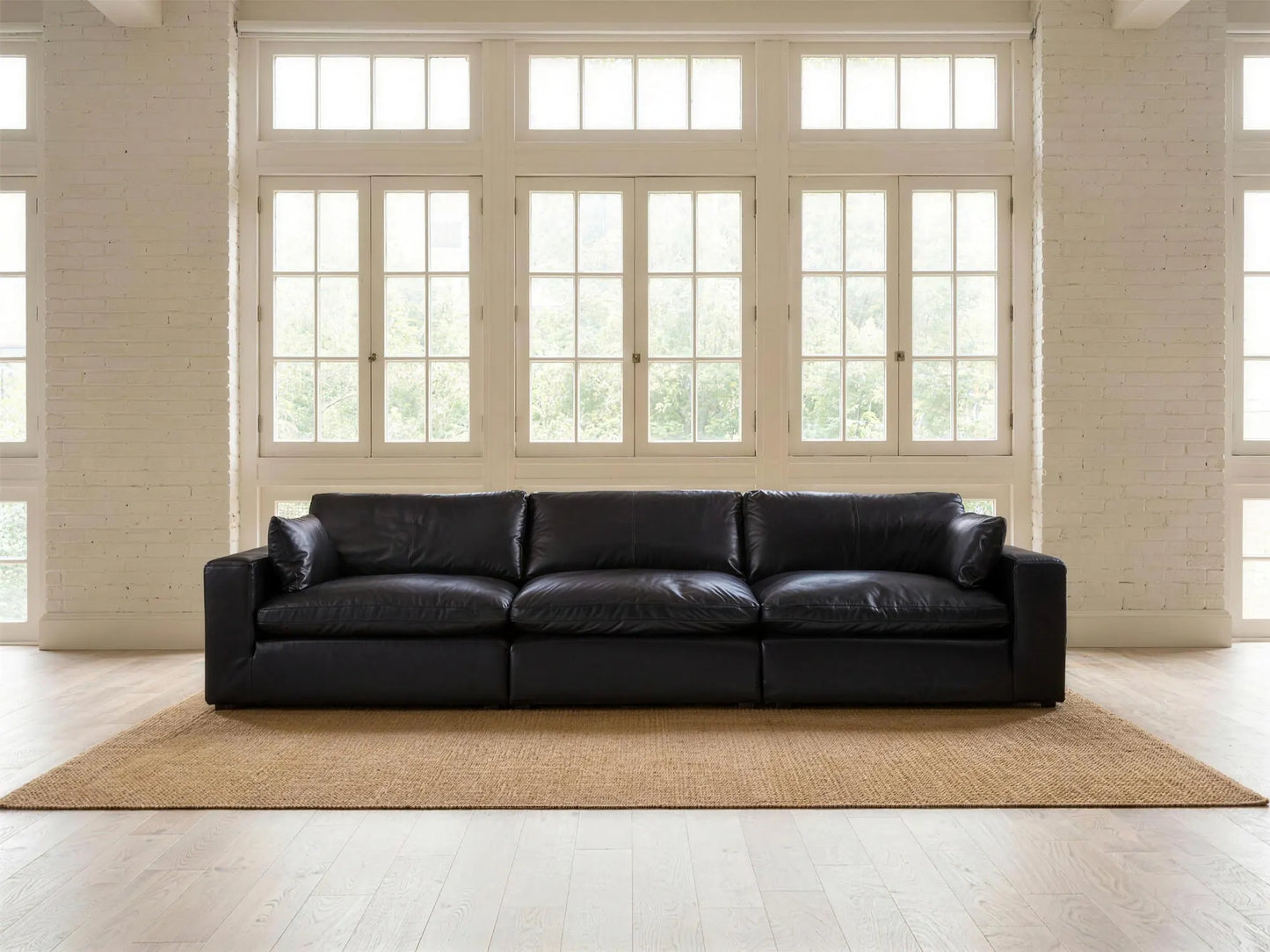 Emilia 3-Piece Sofa in black top-grain leather, styled in a living room