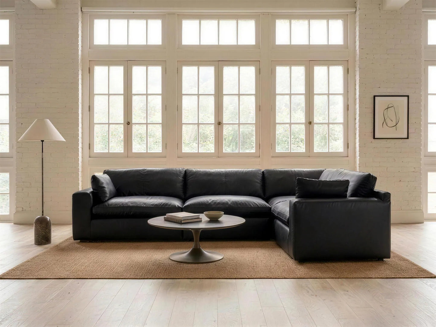 Emilia 4-Piece L-Shape Sectional in black top-grain leather, styled in a living room