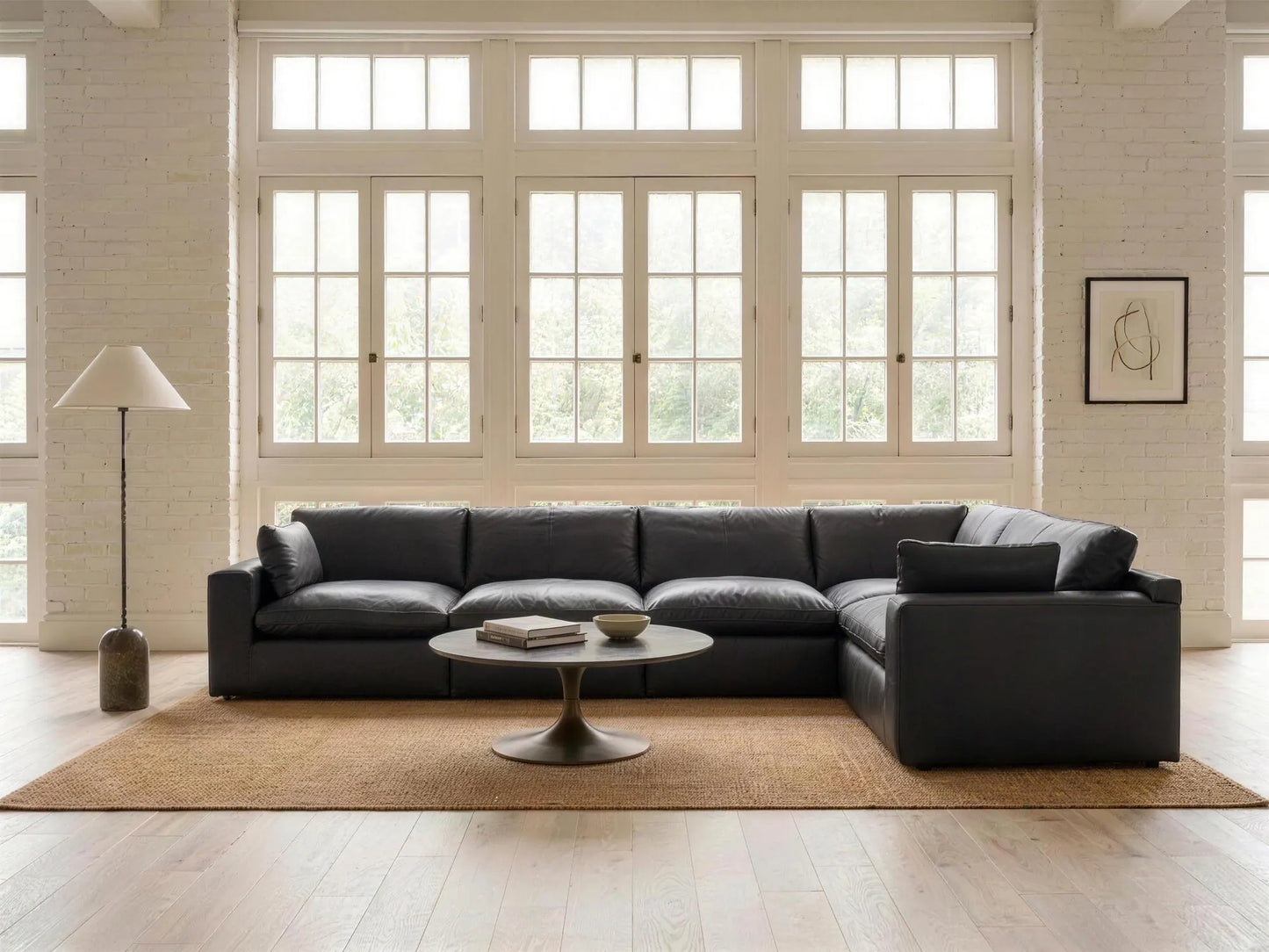 Emilia 5-Piece L-Shape Sectional in black top-grain leather, styled in a living room