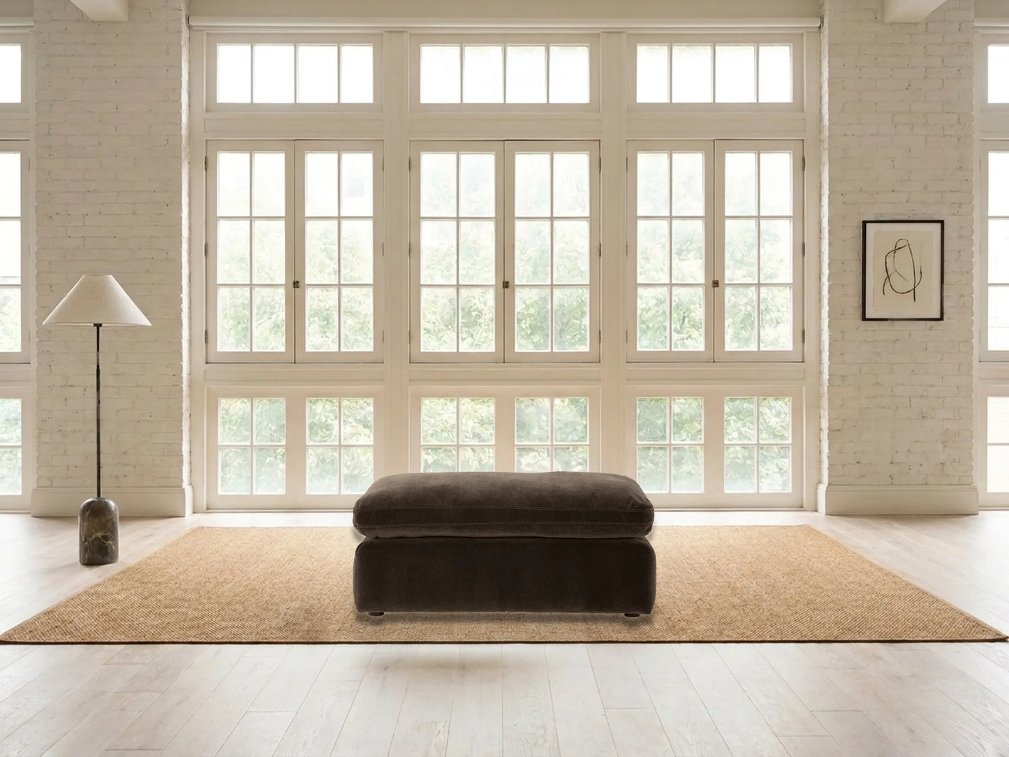 Rowan Velvet Ottoman in Espresso in a living room