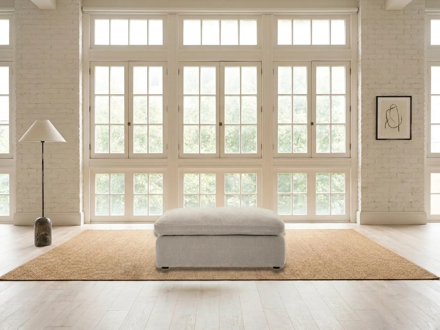 Rowan Velvet Ottoman in Oatmeal in a living room